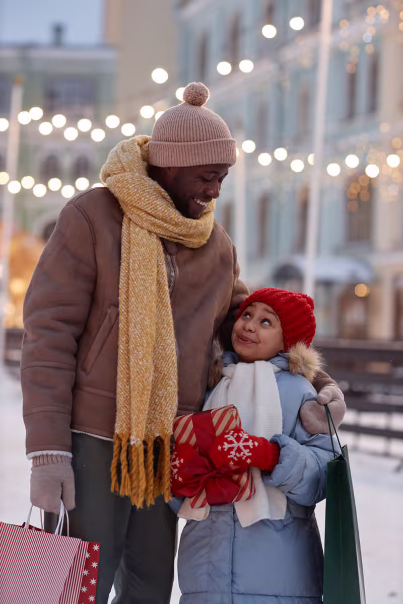 Happy family outdoors representing community wellbeing