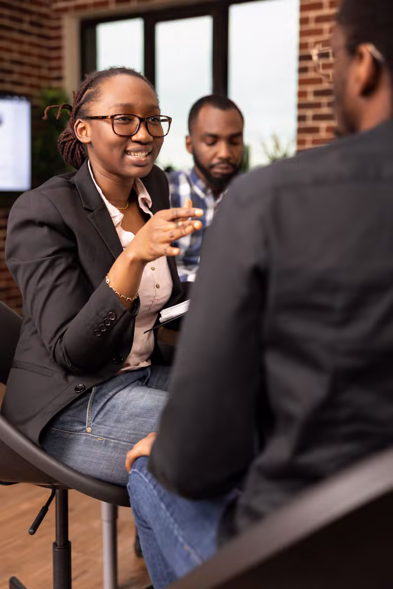 Professionals meeting with community members